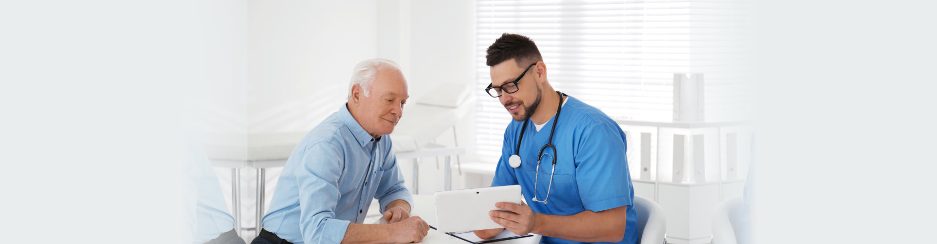 Senior man visiting doctor in modern office