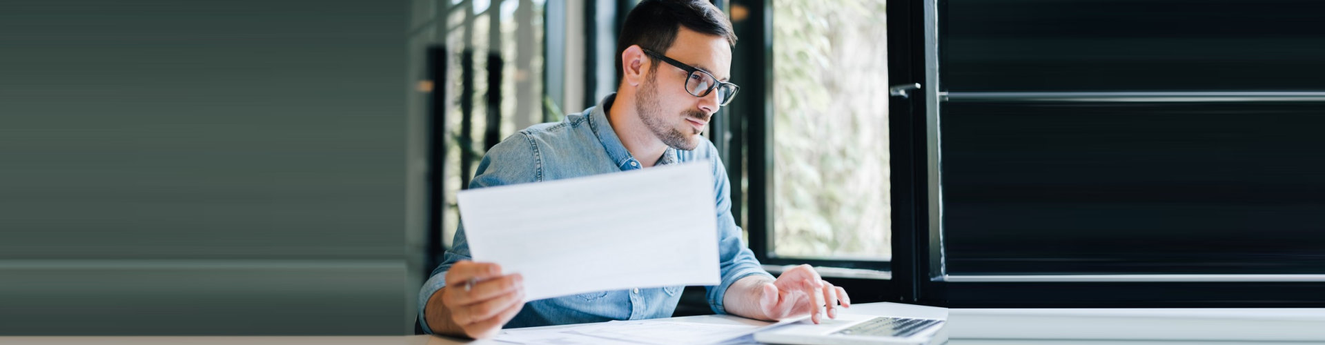 man reading his notes